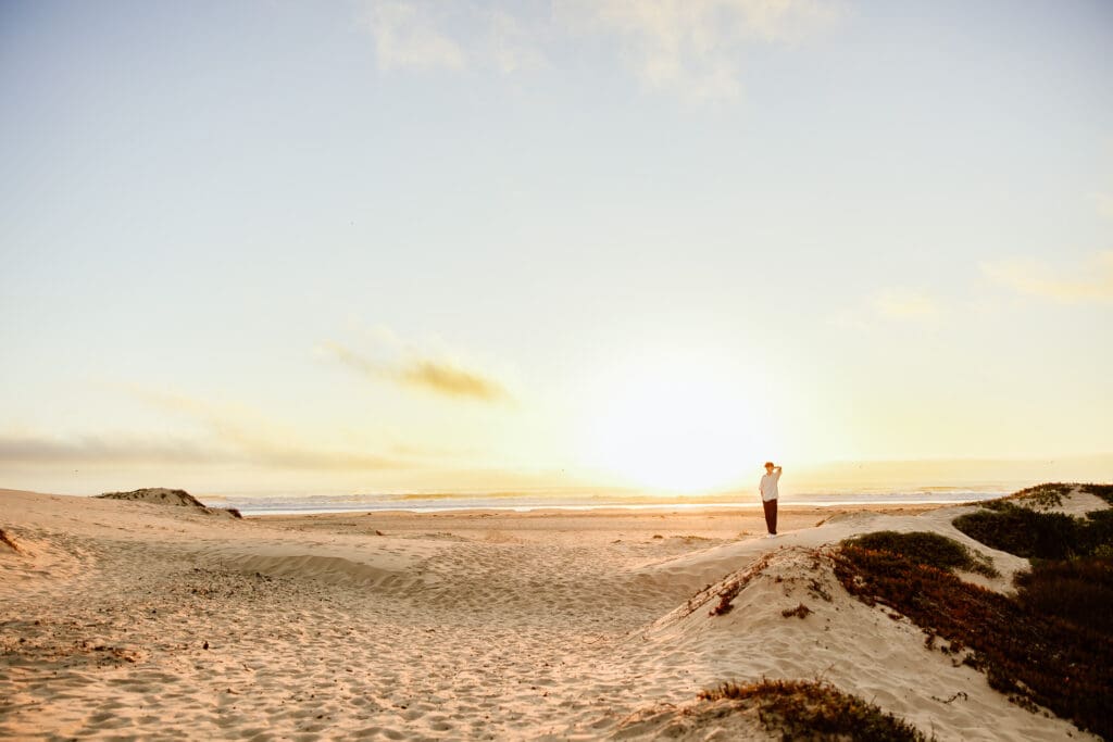 Senior boy at sunset in Pismo Beach for a blog on Monarch Butterfly Grove
