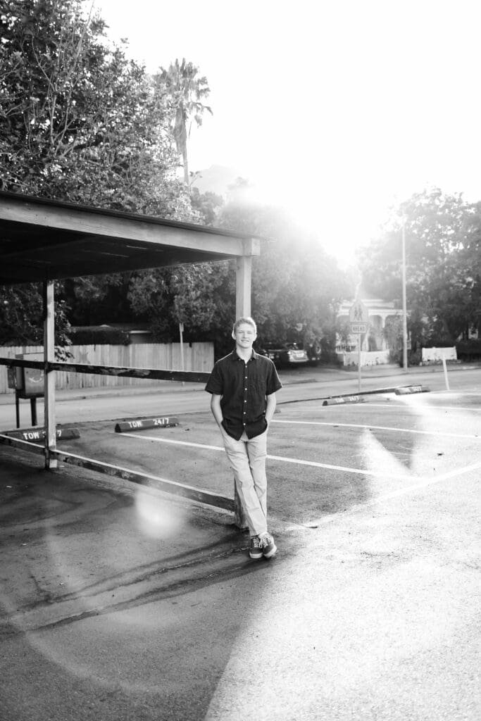 Backlit image of a senior boy in a blog post for what not to do in senior photos