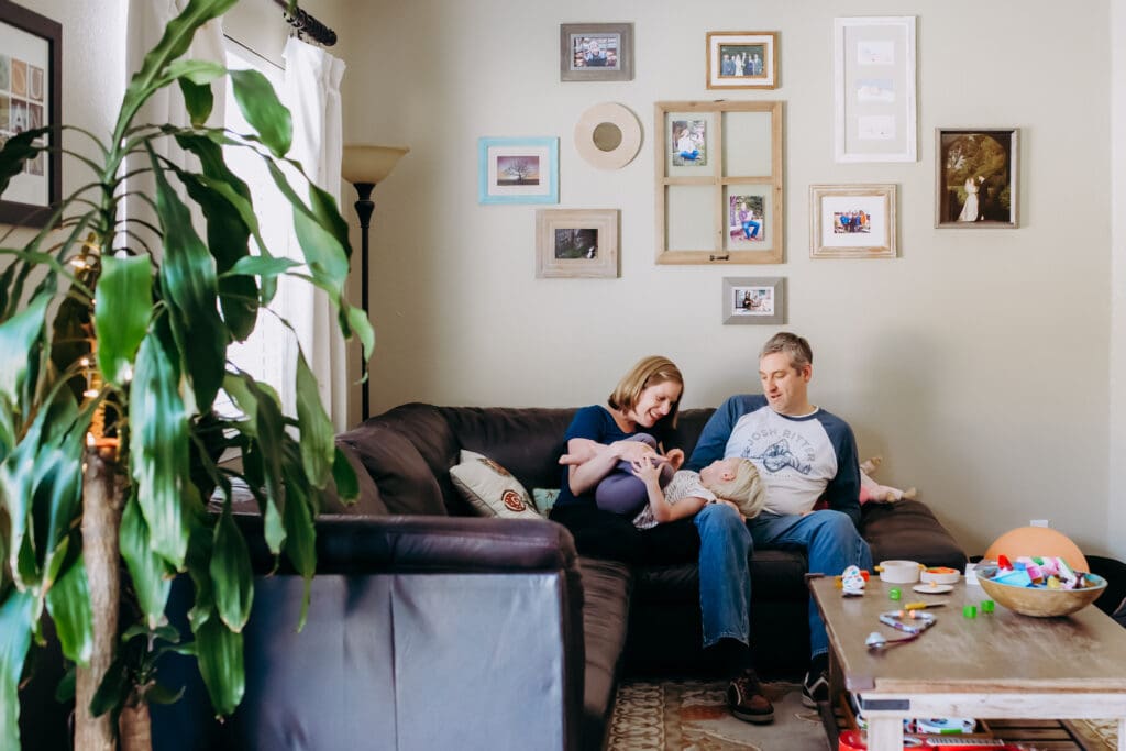 documentary style photo of a family sitting in their living room