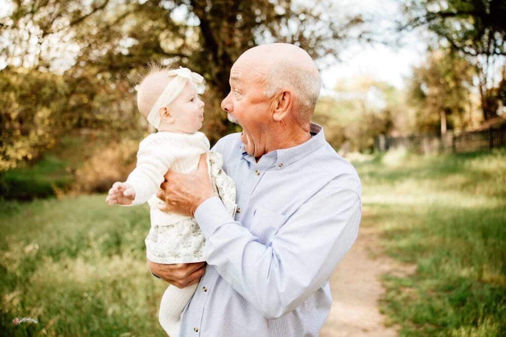 Grandpa making faces at his baby granddaughter