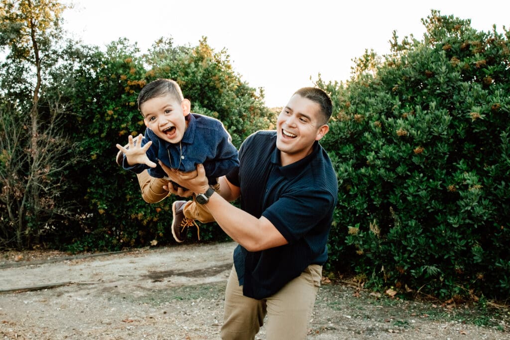 Father and son playing