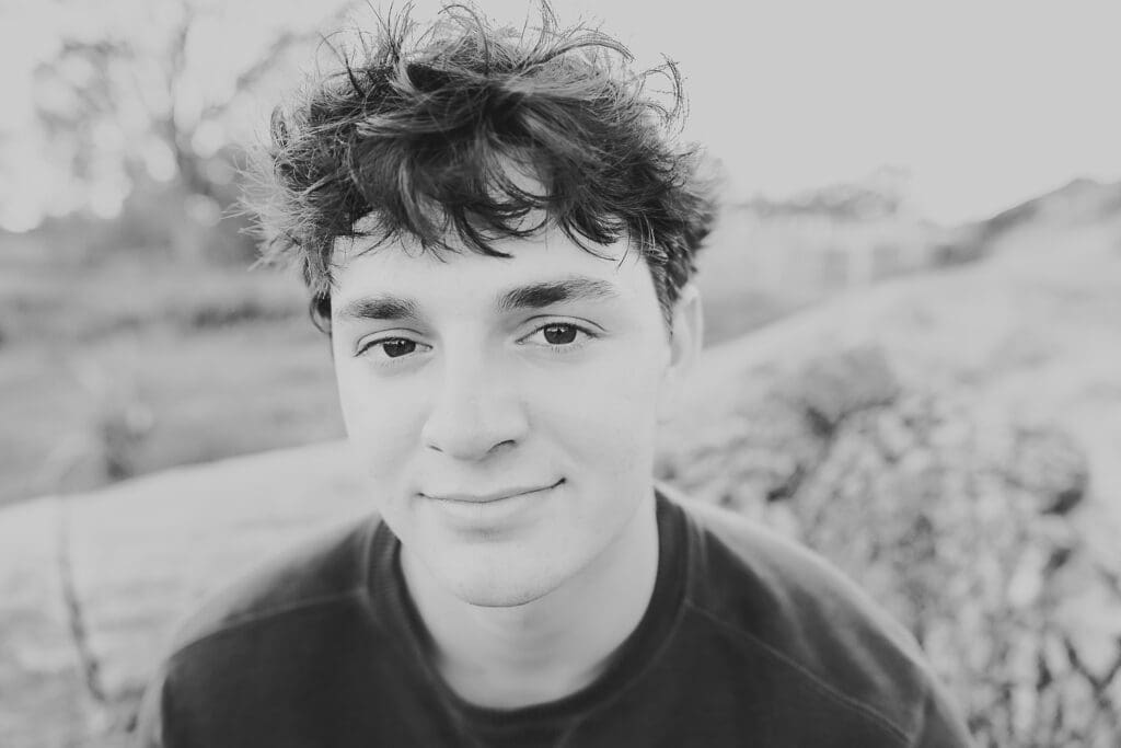 black and white close up portrait of a senior guy
