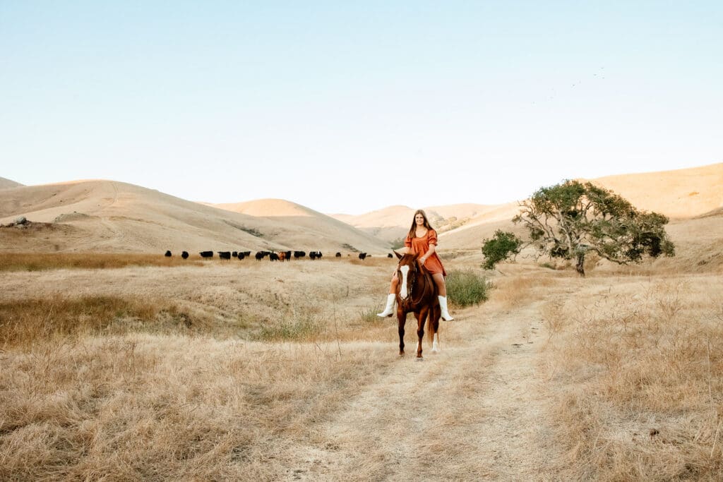 Maryn with her horse Kitty during a senior session on a cattle ranch in Cayucos.