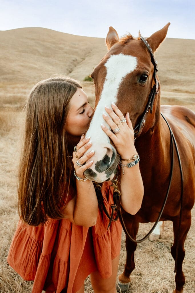 Maryn with her horse Kitty during a senior session on a cattle ranch in Cayucos.