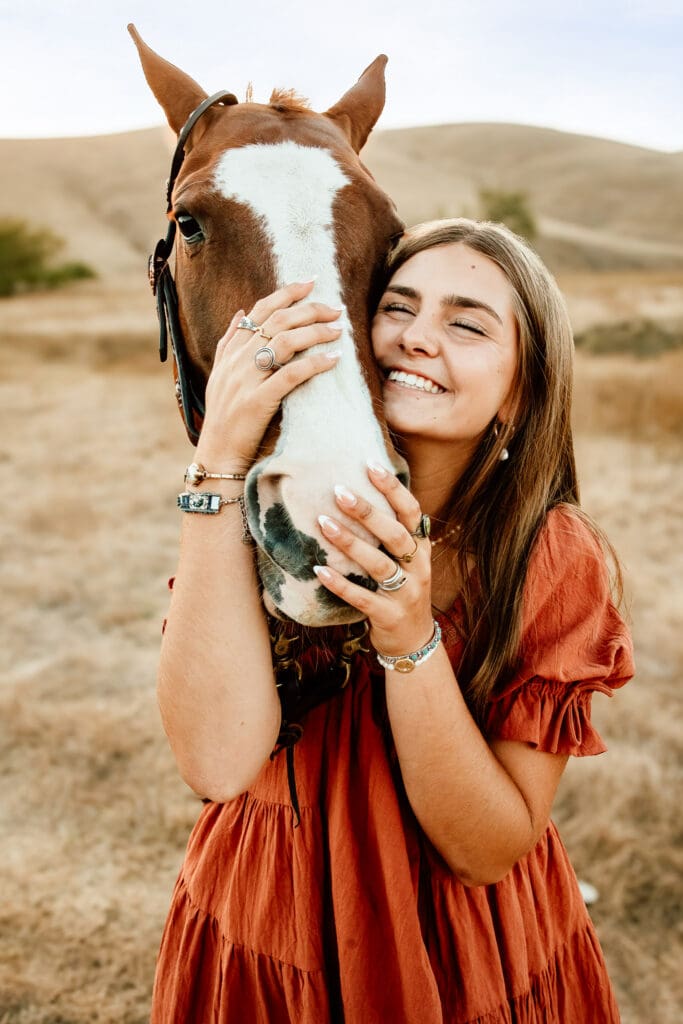 Maryn with her horse Kitty during a senior session on a cattle ranch in Cayucos.