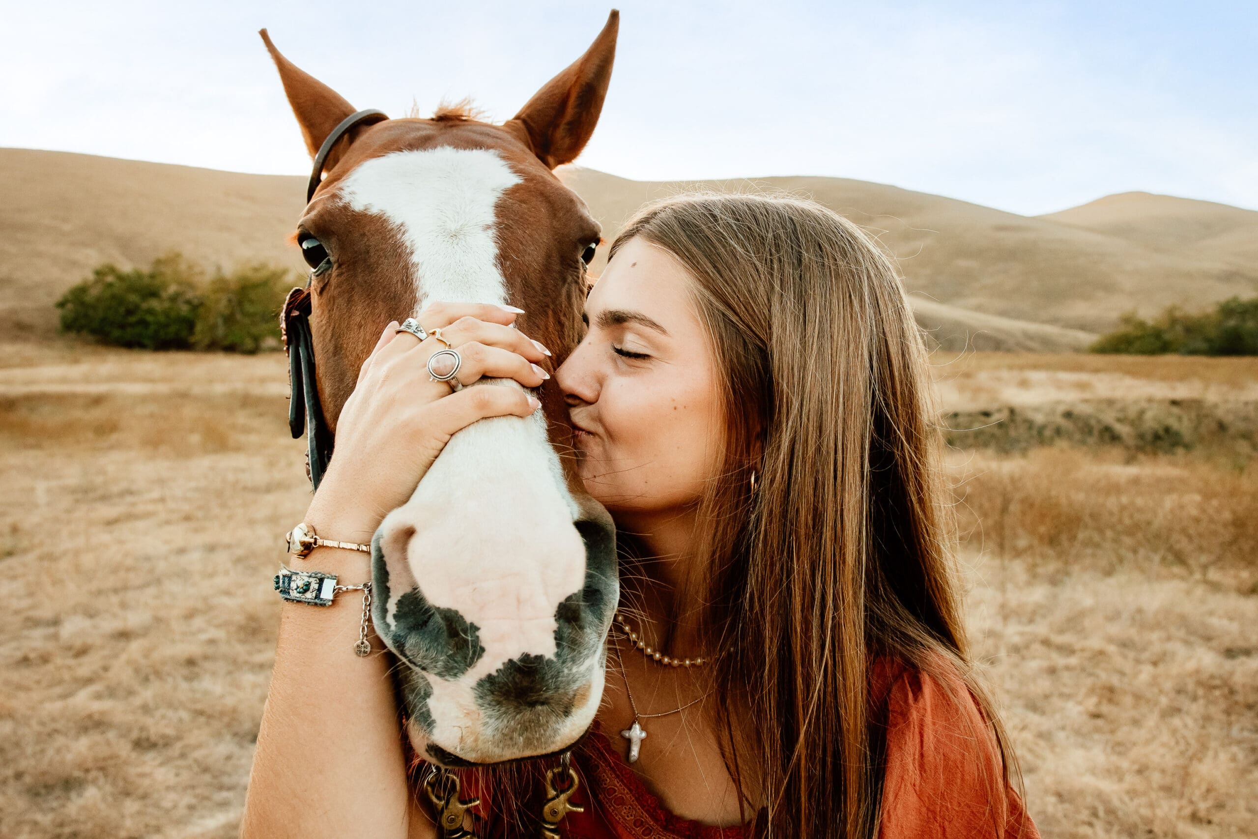 Maryn with her horse Kitty during a senior session on a cattle ranch in Cayucos
