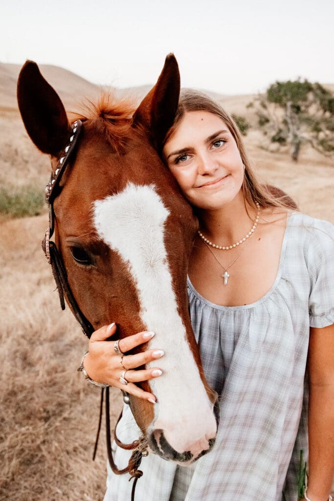 Maryn with her horse Kitty during a senior session on a cattle ranch in Cayucos.