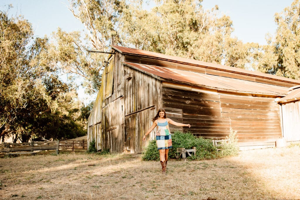 Senior portraits at a rustic barn in Cayucos.